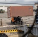 U.S. Marines receive cargo from USNS Guam