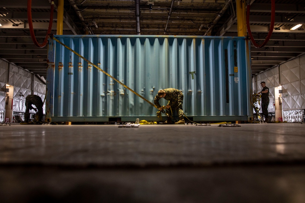 U.S. Marines receive cargo from USNS Guam