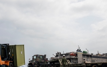 U.S. Marines receive cargo from USNS Guam