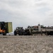U.S. Marines receive cargo from USNS Guam
