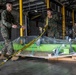 U.S. Marines receive cargo from USNS Guam