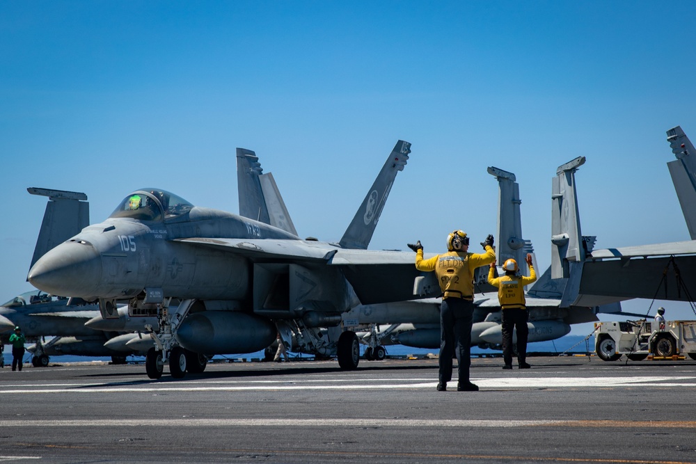 USS Gerald R. Ford (CVN 78) Sailors Signal To F/A-18F Super Hornets
