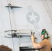 VFA 31 Sailor Conducts Maintenance