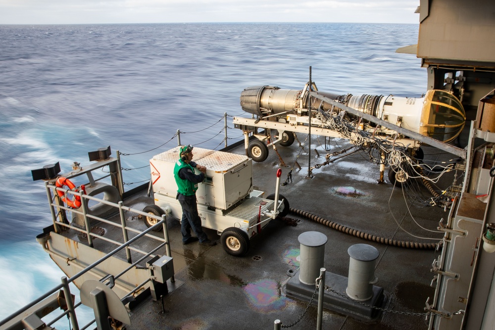 USS Gerald R. Ford (CVN 78) Sailor Observes Jet Engine Maintenance