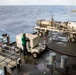 USS Gerald R. Ford (CVN 78) Sailor Observes Jet Engine Maintenance