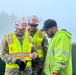 Brig. Gen. Joseph C. &quot;Clete&quot; Goetz and Command Sgt. Maj. Zachary Plummer discuss street flood mitigation efforts with City and Borough of Juneau employee