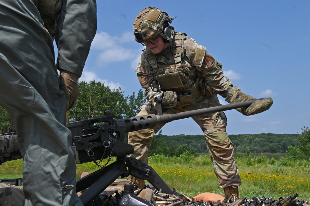 Airman Changes Barrel on Machine Gun