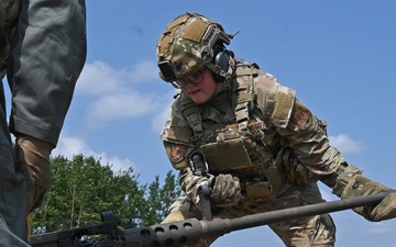 Airman Changes Barrel on Machine Gun