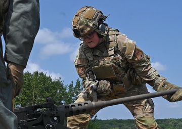 Airman Changes Barrel on Machine Gun