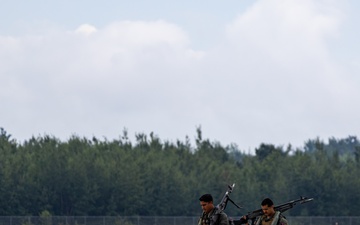 HMLA-775 Coyotes conduct flight line operations in the rain