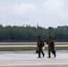 HMLA-775 Coyotes conduct flight line operations in the rain