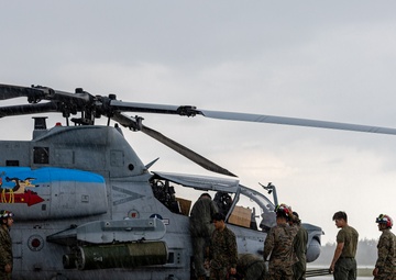 HMLA-775 Coyotes conduct flight line operations in the rain