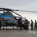 HMLA-775 Coyotes conduct flight line operations in the rain
