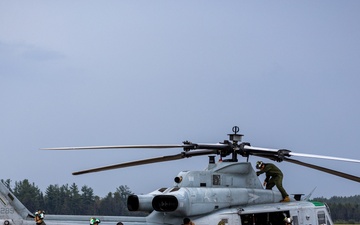 HMLA-775 Coyotes conduct flight line operations in the rain
