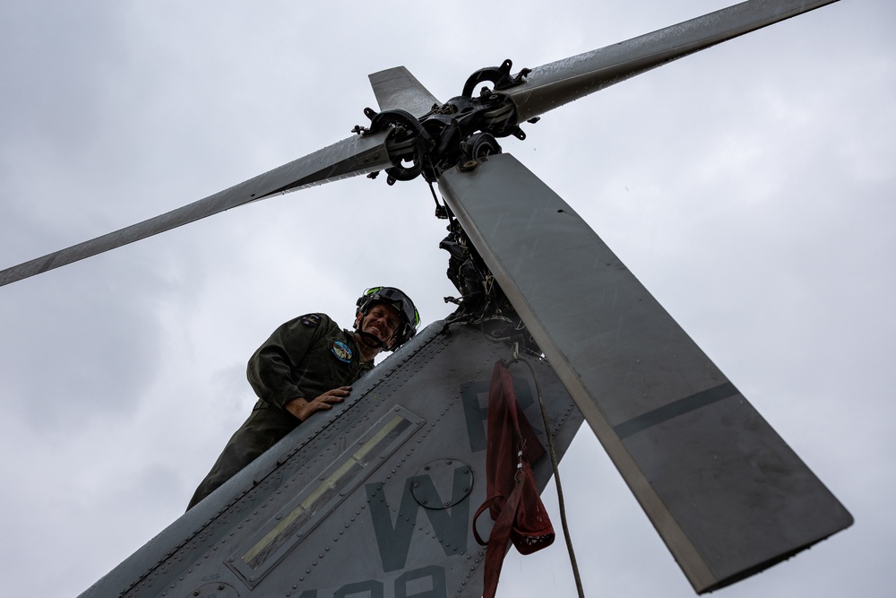 HMLA-775 Coyotes conduct flight line operations in the rain
