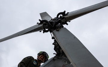 HMLA-775 Coyotes conduct flight line operations in the rain