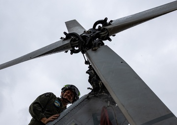 HMLA-775 Coyotes conduct flight line operations in the rain
