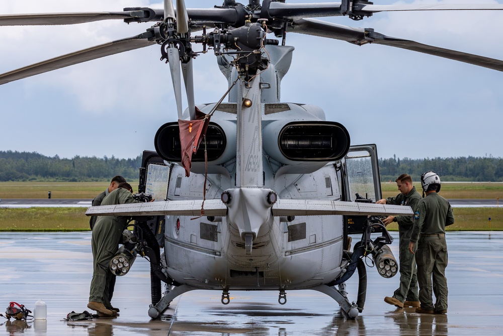 HMLA-775 Coyotes conduct flight line operations in the rain