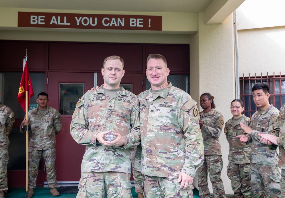 Sgt. Spencer A. Kuzara (498th CSSB) and Cadet Angelina Munoz were awarded a Brigade coin today by Col. R. Scott Carpenter, commander of U.S. Army Materiel Support Command–Korea.