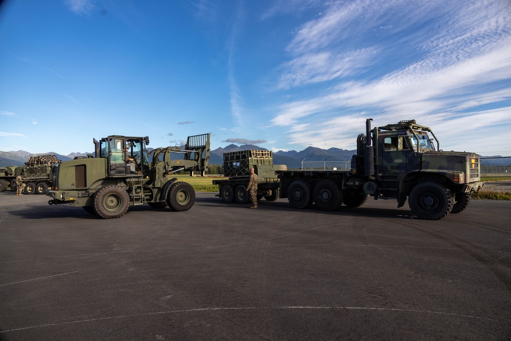 U.S. Marines with 3rd Bn., 4th Marines, move equipment and personnel during Arctic Edge 25