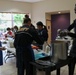 COMLCSRON One volunteers at Third Avenue Charitable Organization