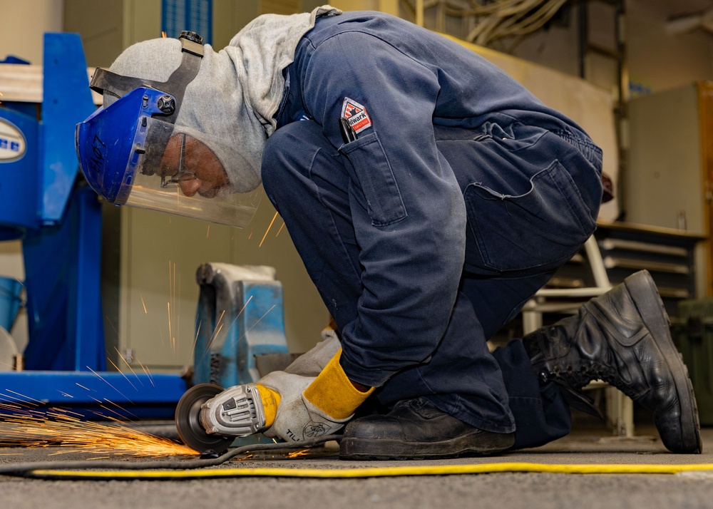 USS Gerald R. Ford (CVN 78) Sailor Conducts Maintenance