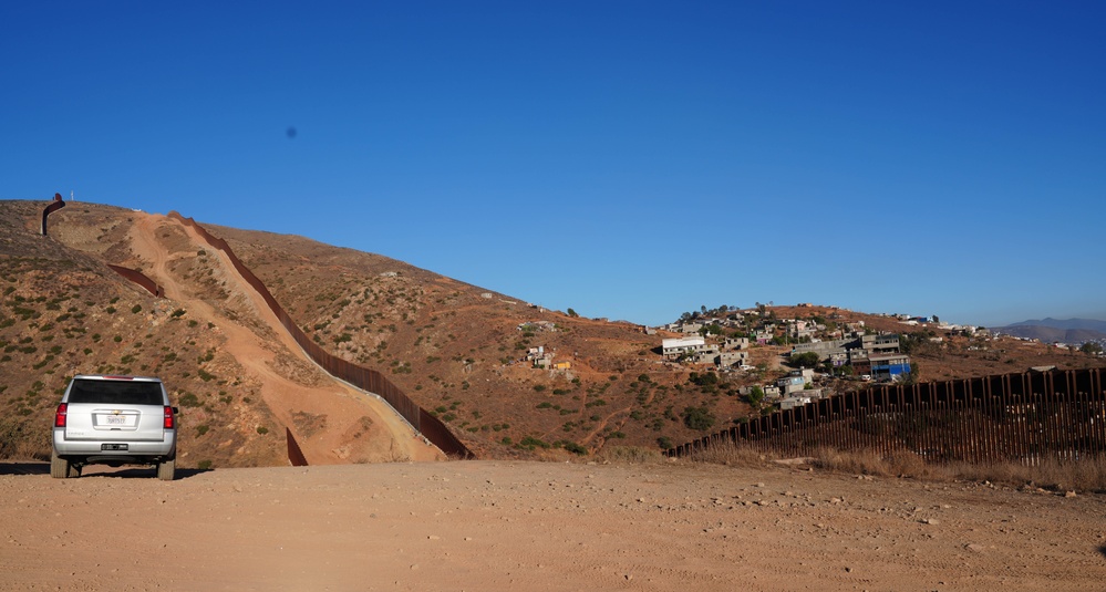 CBP Commissioner Rodney S. Scott tours the U.S. – Mexico border wall near San Diego