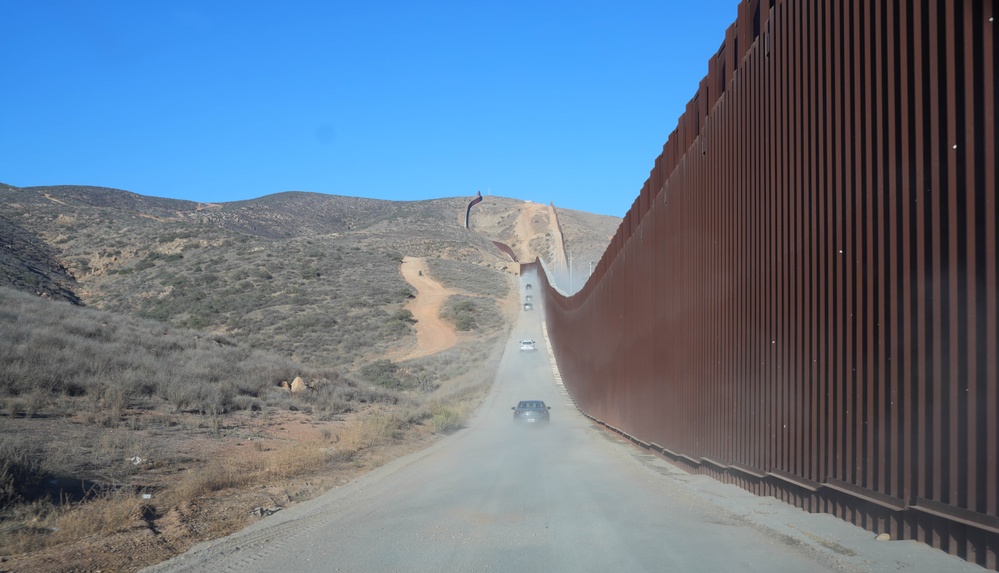 CBP Commissioner Rodney S. Scott tours the U.S. – Mexico border wall near San Diego