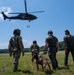 Maryland Army National Guardsmen engage with police K-9s during flight familiarization