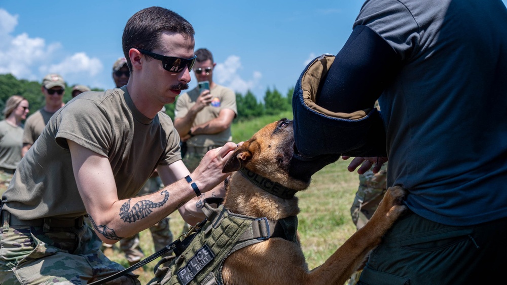 Maryland Army National Guardsmen engage with police K-9s during flight familiarization