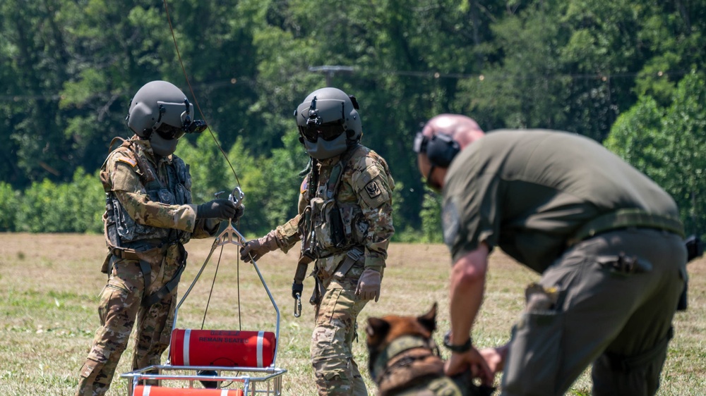 Maryland Army National Guardsmen engage with police K-9s during flight familiarization