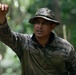 Panamanian and USMC members learn about flora and fauna during jungle survival course