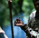 Panamanian and USMC members learn about flora and fauna during jungle survival course