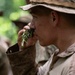 Panamanian and USMC members learn about flora and fauna during jungle survival course