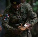 Panamanian and USMC members learn about flora and fauna during jungle survival course