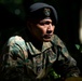 Panamanian and USMC members learn about flora and fauna during jungle survival course