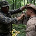 Panamanian and USMC members learn about flora and fauna during jungle survival course
