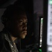 USS Mitscher (DDG 57) Sailor stands surface warfare supervisor in CDC