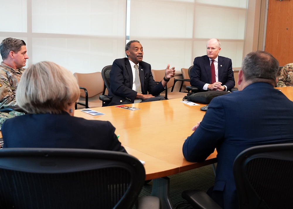 USUHS President talks with Tri-Service Dental Researchers