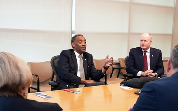 USUHS President talks with Tri-Service Dental Researchers