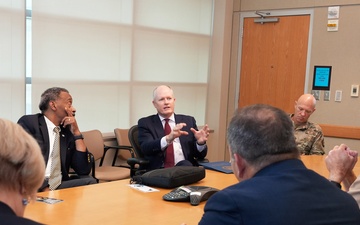 USUHS President talks with Tri-Service Dental Researchers