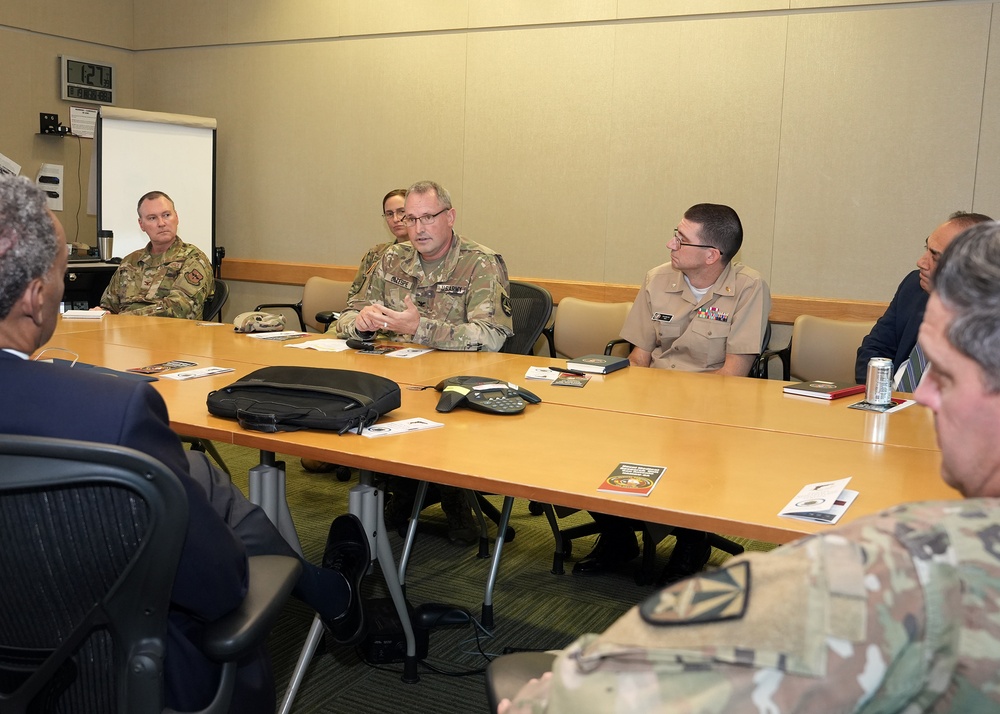 USUHS President talks with Tri-Service Dental Researchers
