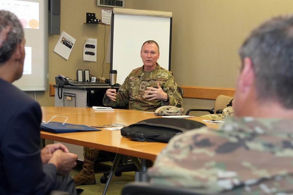 USUHS President talks with Tri-Service Dental Researchers