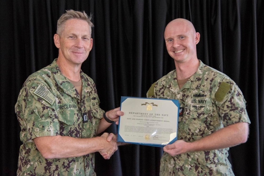 Sailor Accepts Award