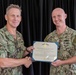 Sailor Accepts Award