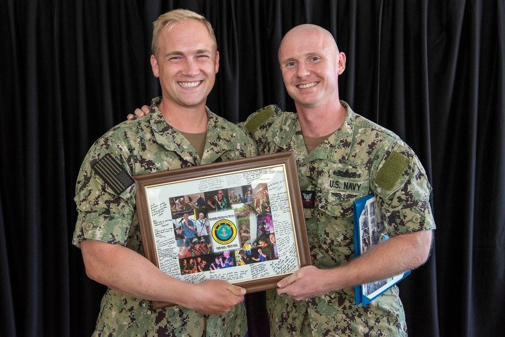 Sailor Accepts Award