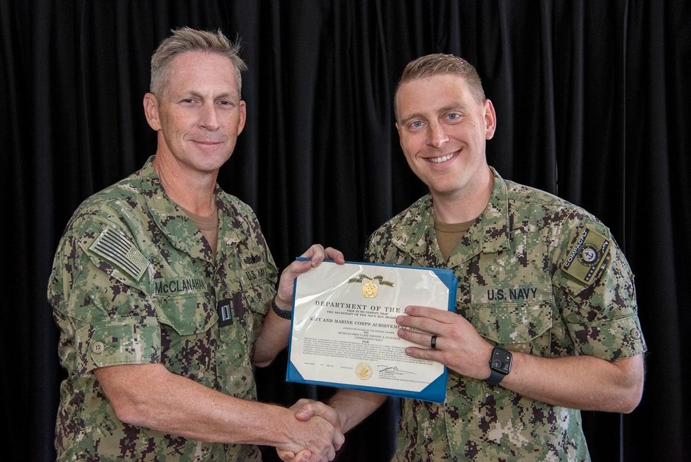 Sailor Accepts Award