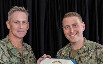 Sailor Accepts Award