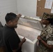 Koa Moana 25 Sailors Conduct Food Inspection