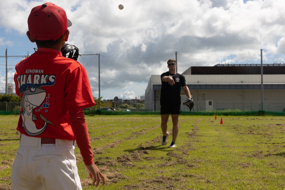 HMLA-169 Marines play baseball with local youth baseball team
